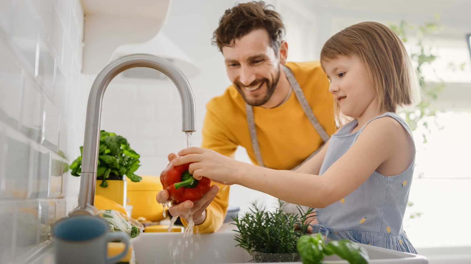 Washing vegetables in sink